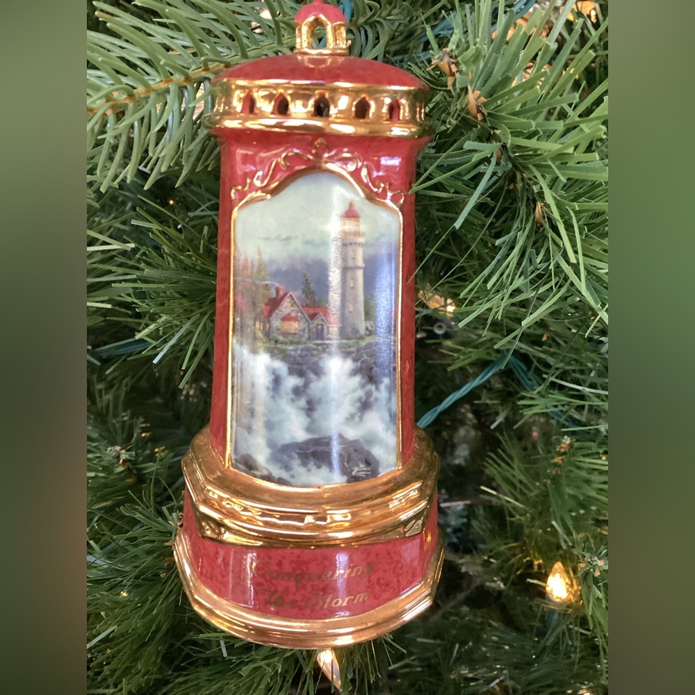 Thomas Kinkade “Painter of Light” collectible lighthouse ornament.